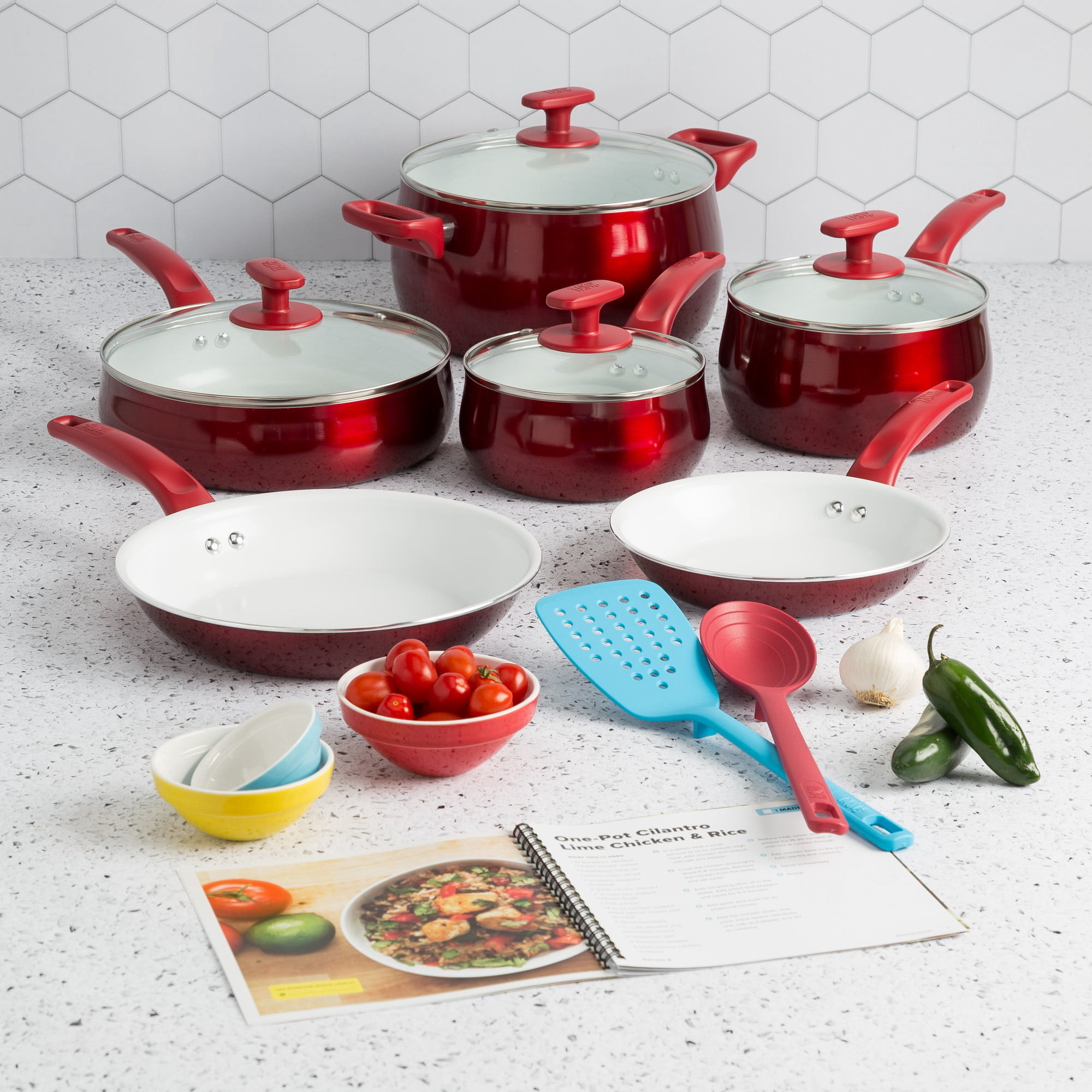 a red set of pots and pans
