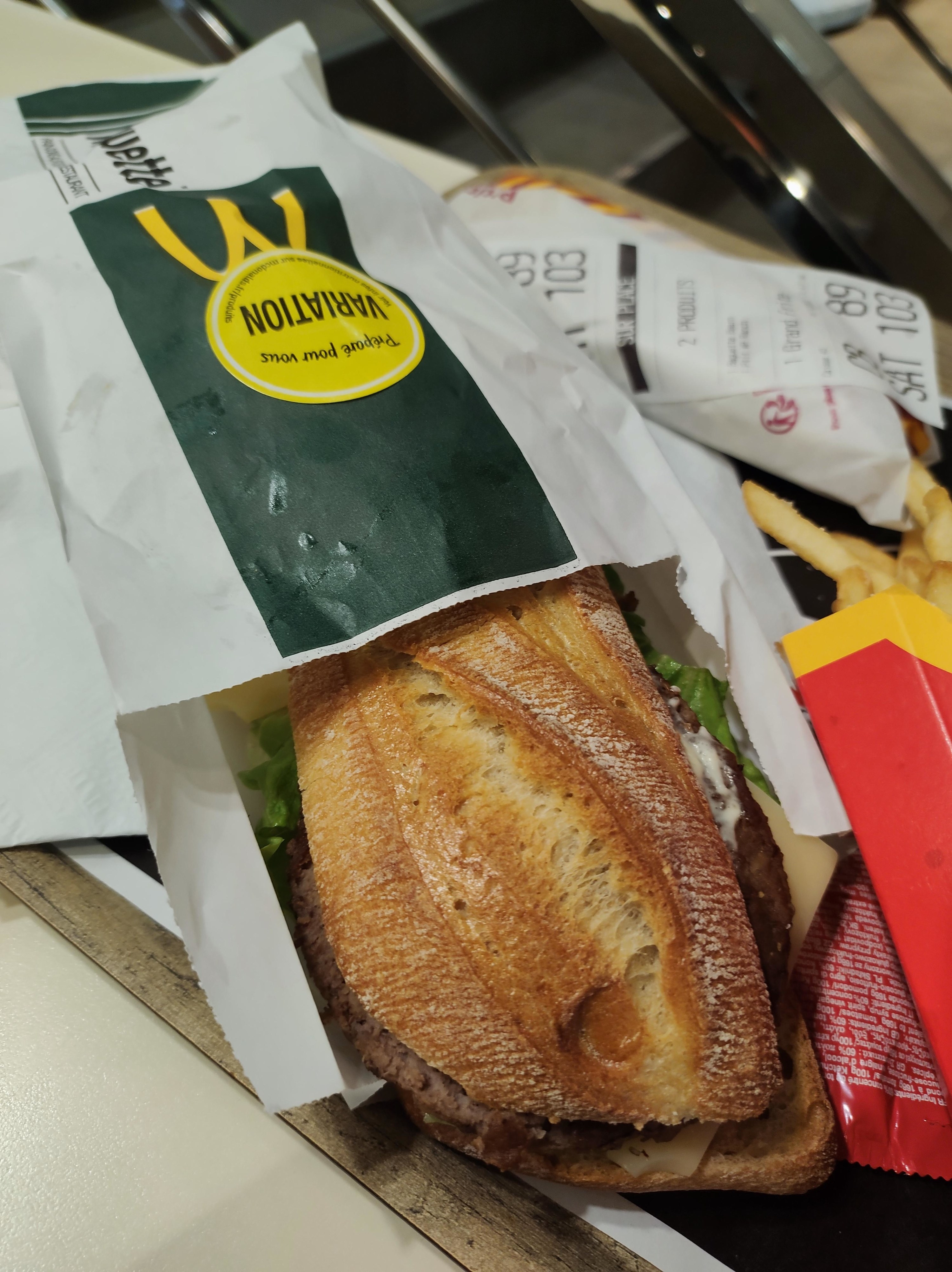 A baguette emerging from McDonald&#x27;s packaging
