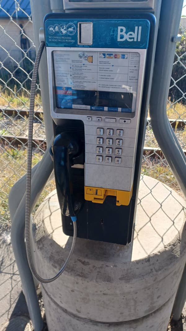 A Bell touch-tone public phone with options for credit cards