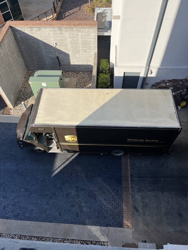 An aerial view of a brown UPS showing the beige roof