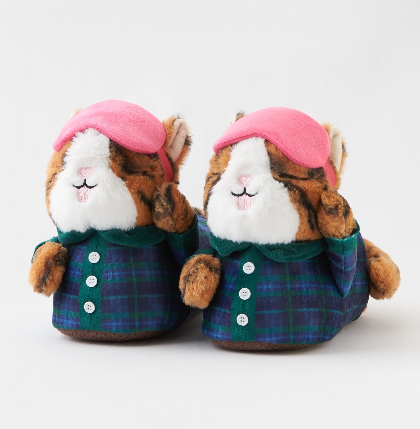 slippers whose toes are fuzzy animals wearing plaid pjs and pink sleep masks