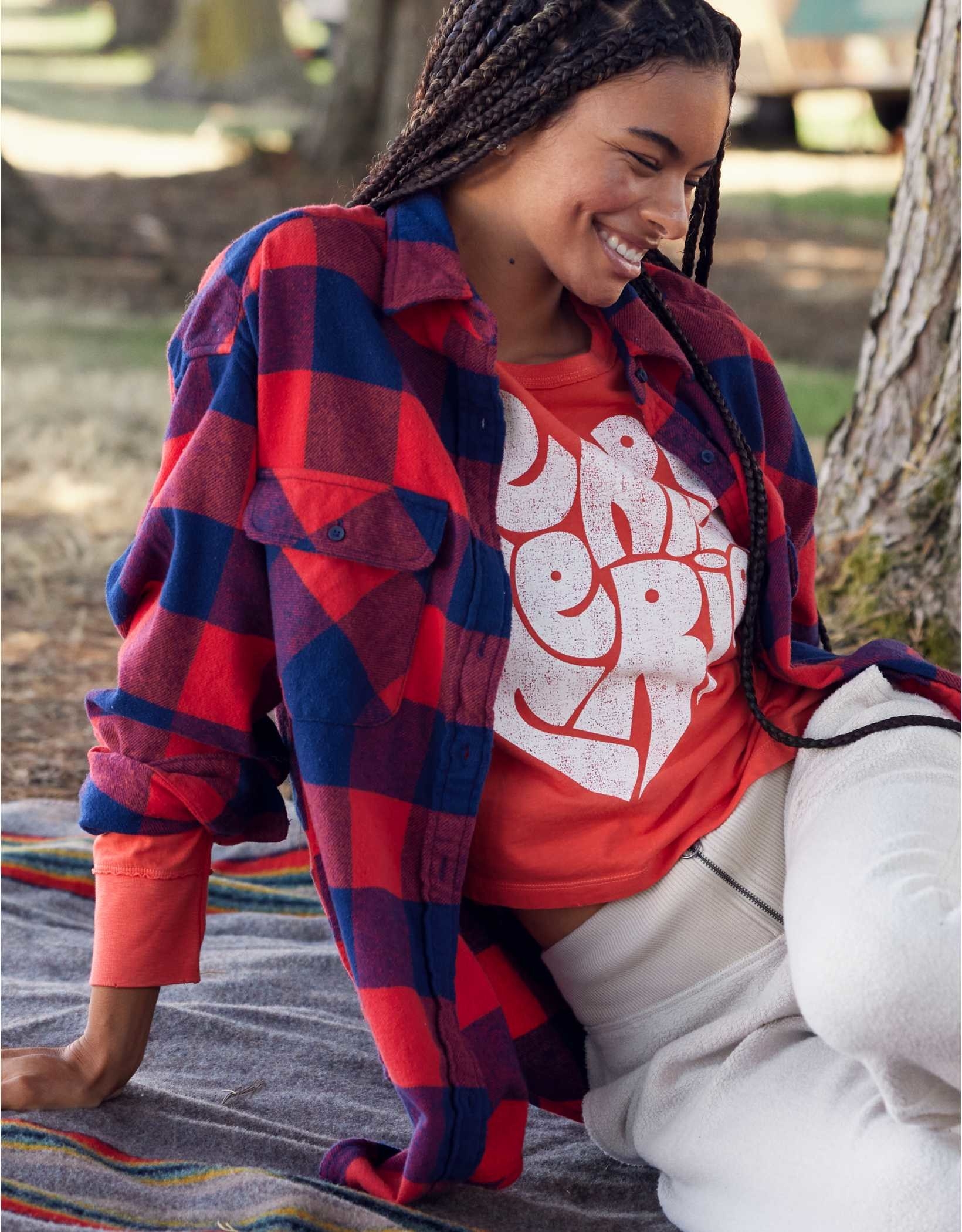 model in blue and red checkered flannel shirt