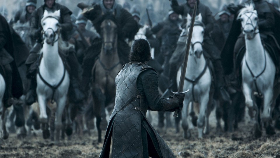 Jon Snow with his back turned getting ready for battle