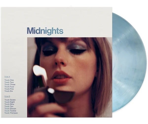 the front cover of the vinyl with the coloured disc popping through