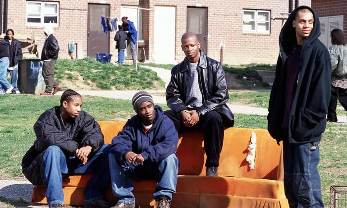 The cast of &quot;The Wire&quot; sitting on an orange couch