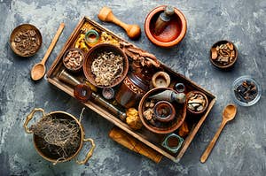 A potion making kit of spices, jars, and mashers