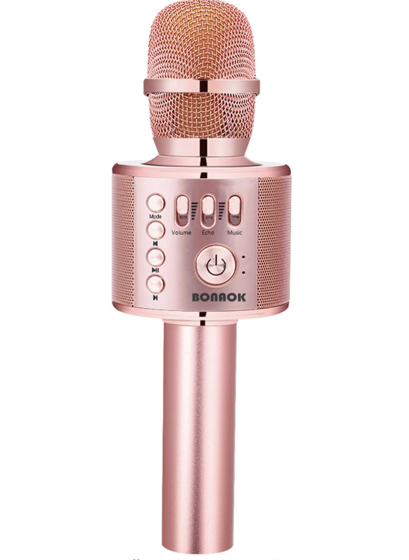 the microphone in front of a plain background