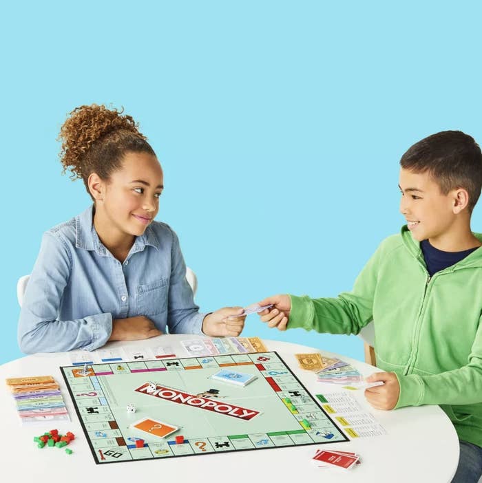 Two kids playing the board game