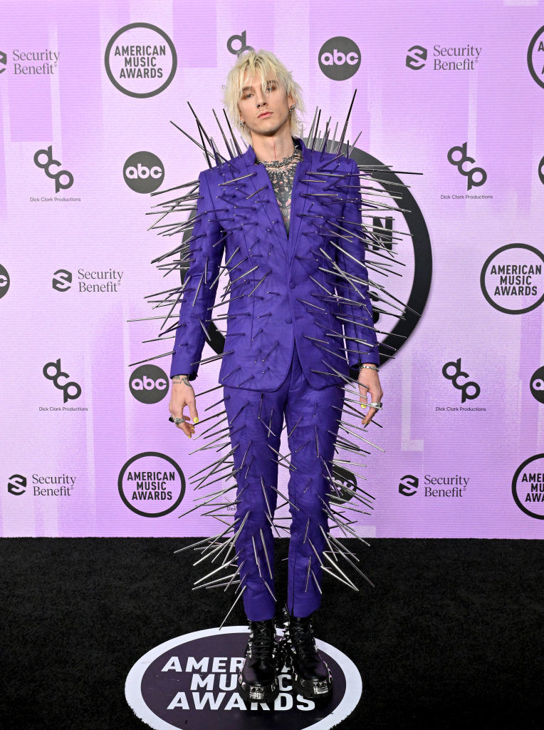 Machine Gun Kelly in a suit covered in sharp spikes