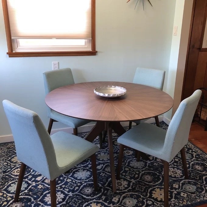 a reviewer photo of the table with chairs around it