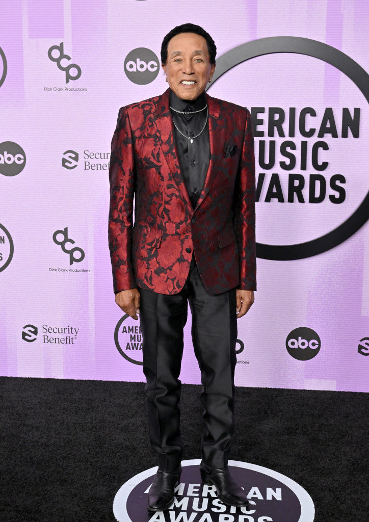 Smokey Robinson in a embossed suit jacket and slacks
