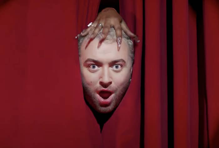 Sam Smith&#x27;s face peering through a curtain