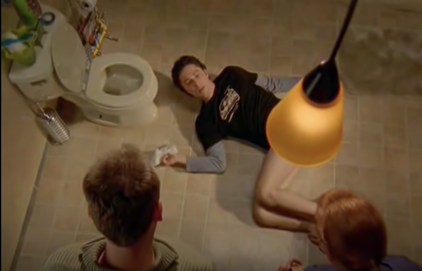 Zach Braff as JD from &quot;Scubs&quot; with his trousers down passed out next to the toilet