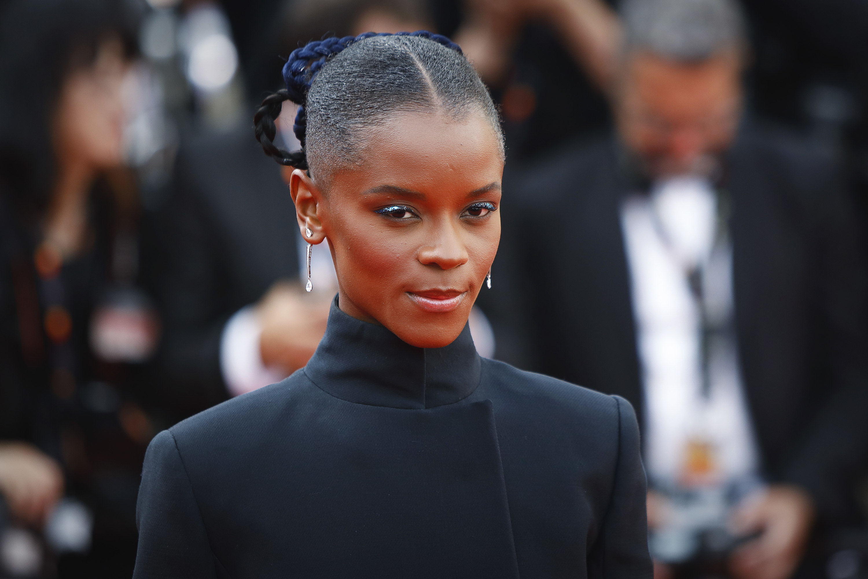 A closeup of Letitia in a turtleneck on the red carpet