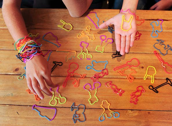 photo of a child&#x27;s hand grabbing Silly Bandz