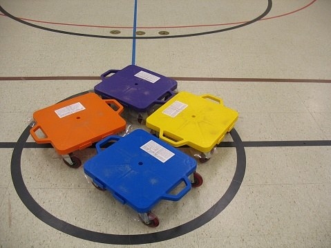 photo of sitting scooters in a school gym