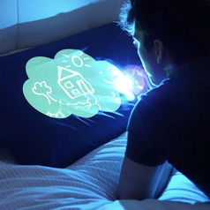 A person drawing on the pillowcase