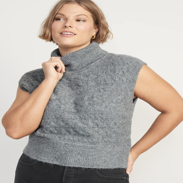 A person wearing a sweater vest