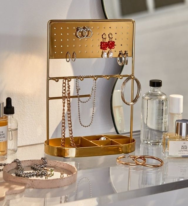 a metallic jewellery display on a vanity