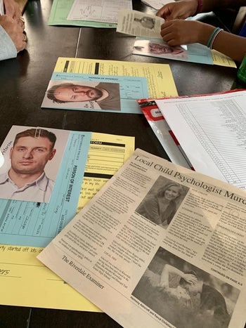 Close up of reviewer's table with case info laid out