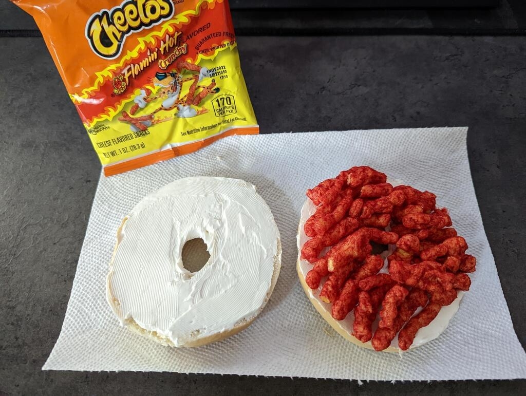 Cream cheese and hot Cheetos on a bagel.