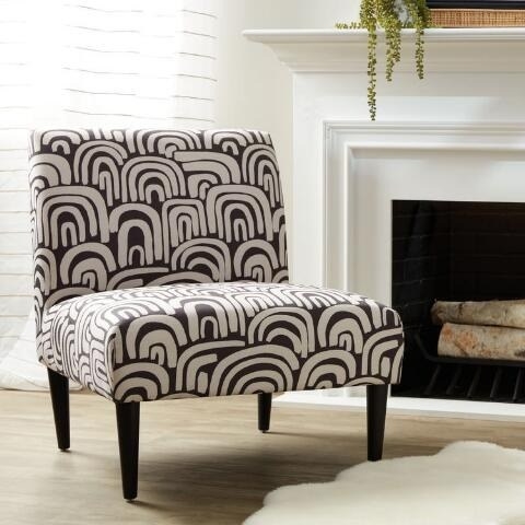 a black and white abstract printed slipper chair