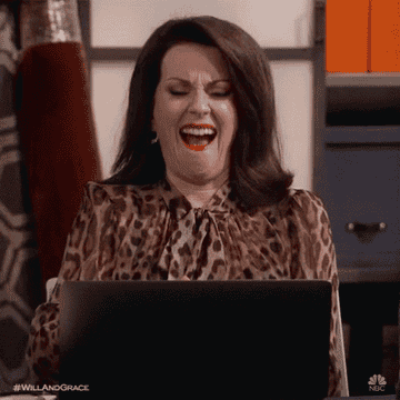 Karen from Will and Grace doing a fist pump