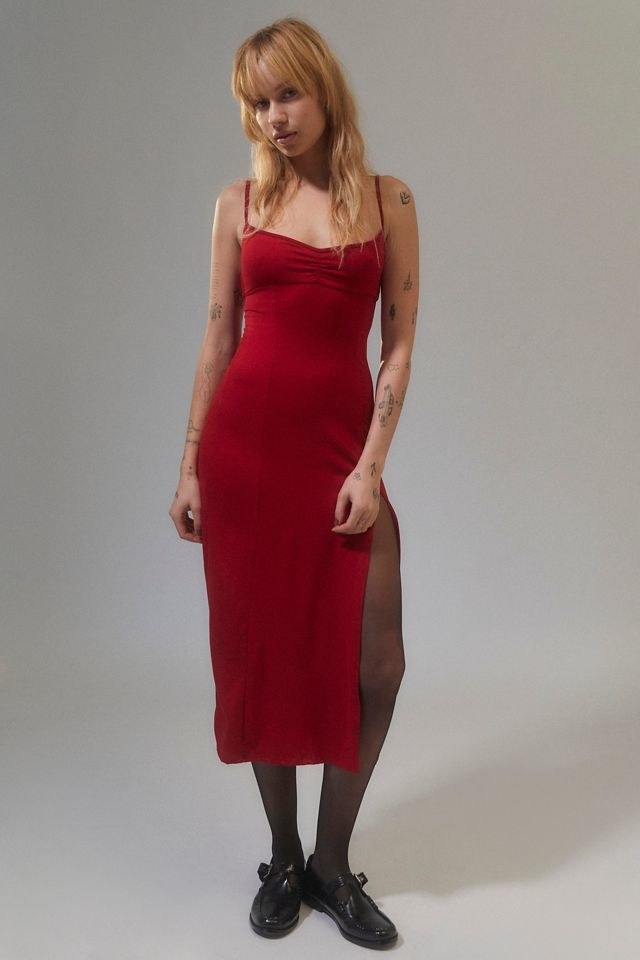 a person wearing a slinky midi dress with tights