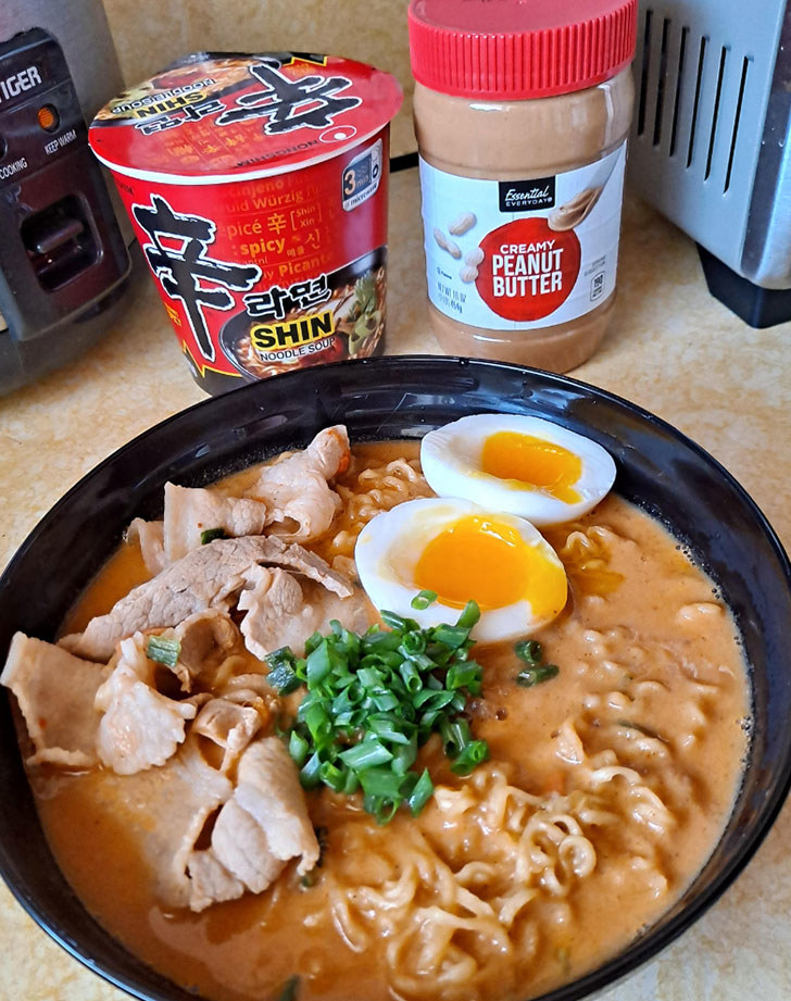 Ramen with peanut butter, meat, and egg.