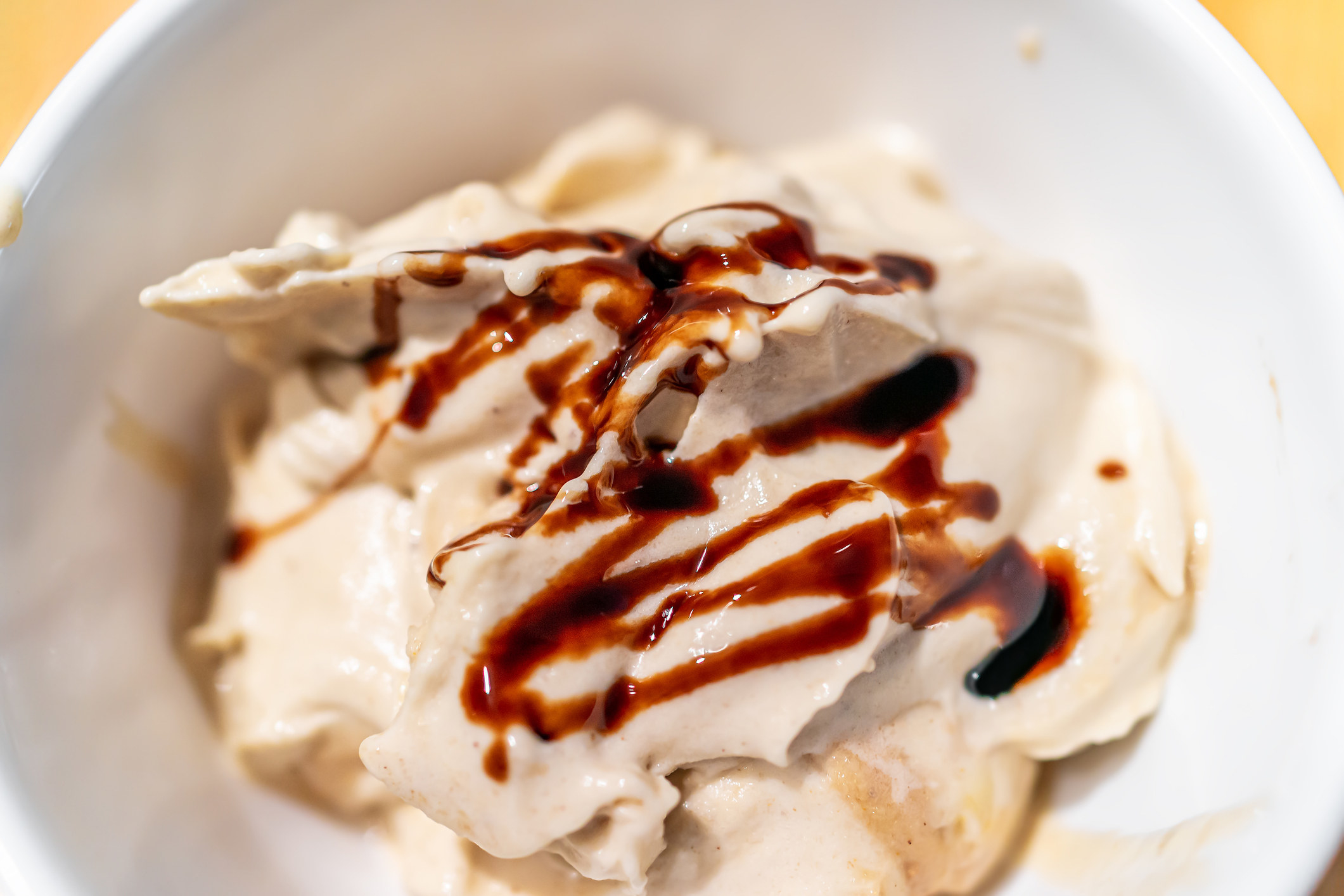 Soft serve vanilla ice cream with balsamic vinegar drizzle.