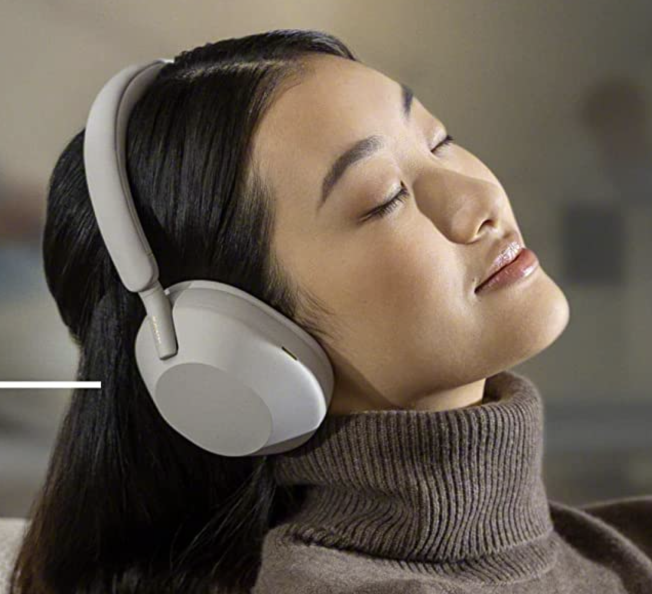 a person wearing the headphones with their eyes closed