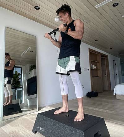 A man using the Arena gym in his bedroom