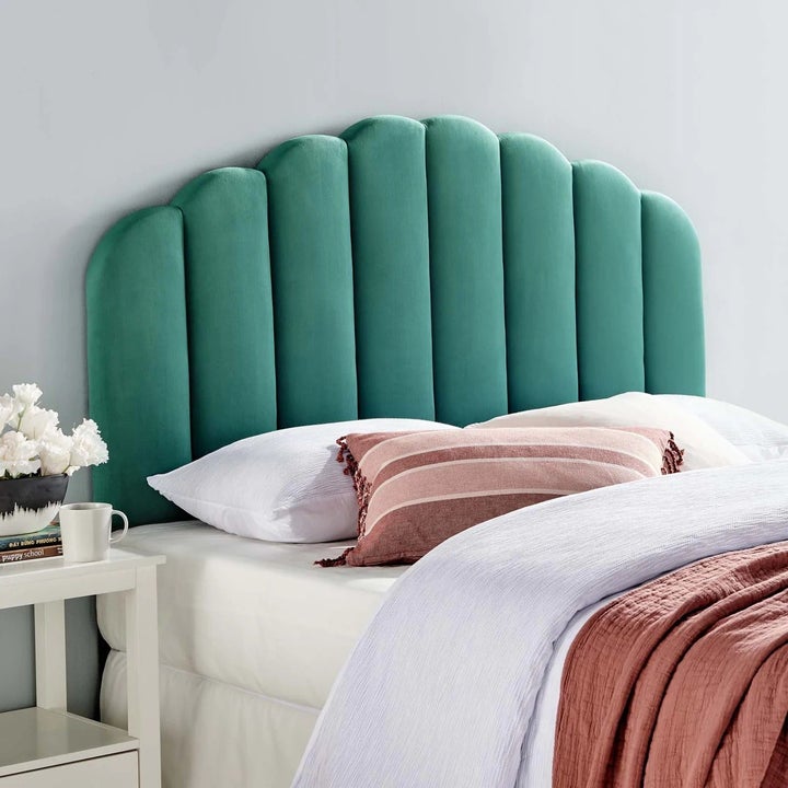 a teal upholstered headboard