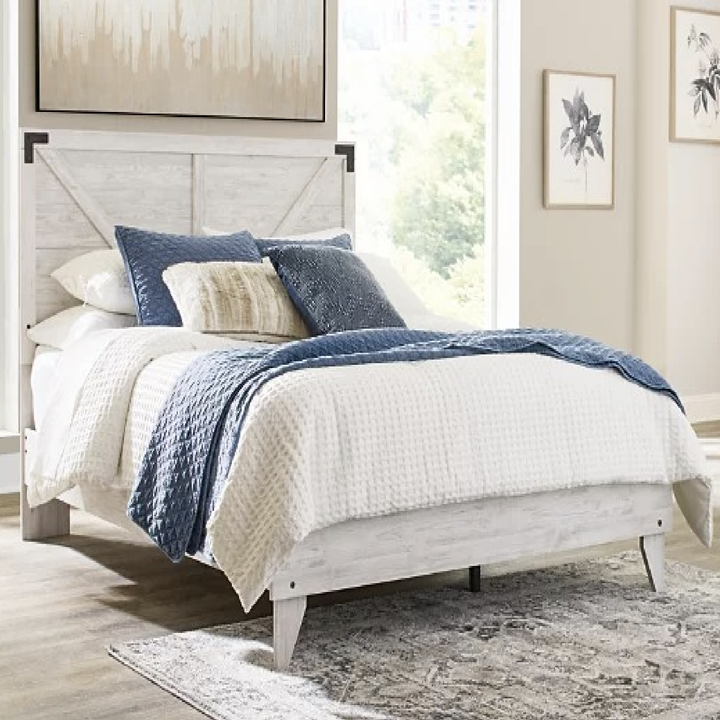 a white wooden platform bed