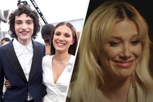 Finn Wolfhard wears a blue suit with a white shirt while Mille Bobby Brown wears a white dress. She also appears with blond hair and pink lipstick.