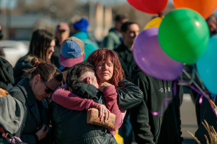 Friends of victims hugging