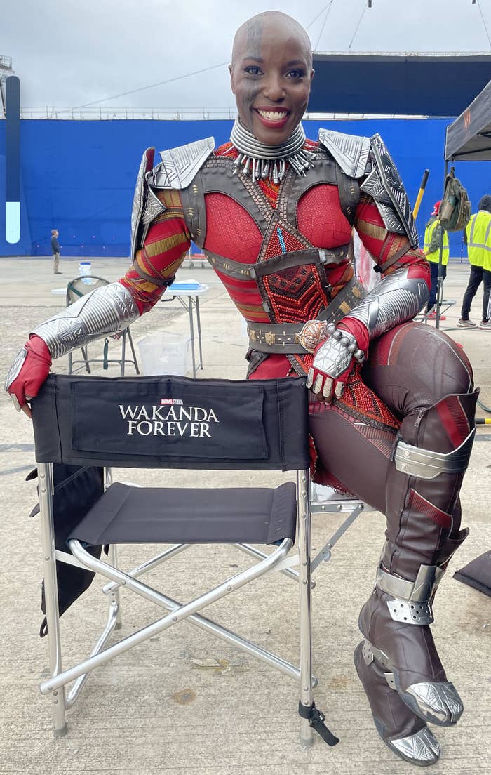 Janeshia Adams-Ginyard sits on set of Wakanda Forever