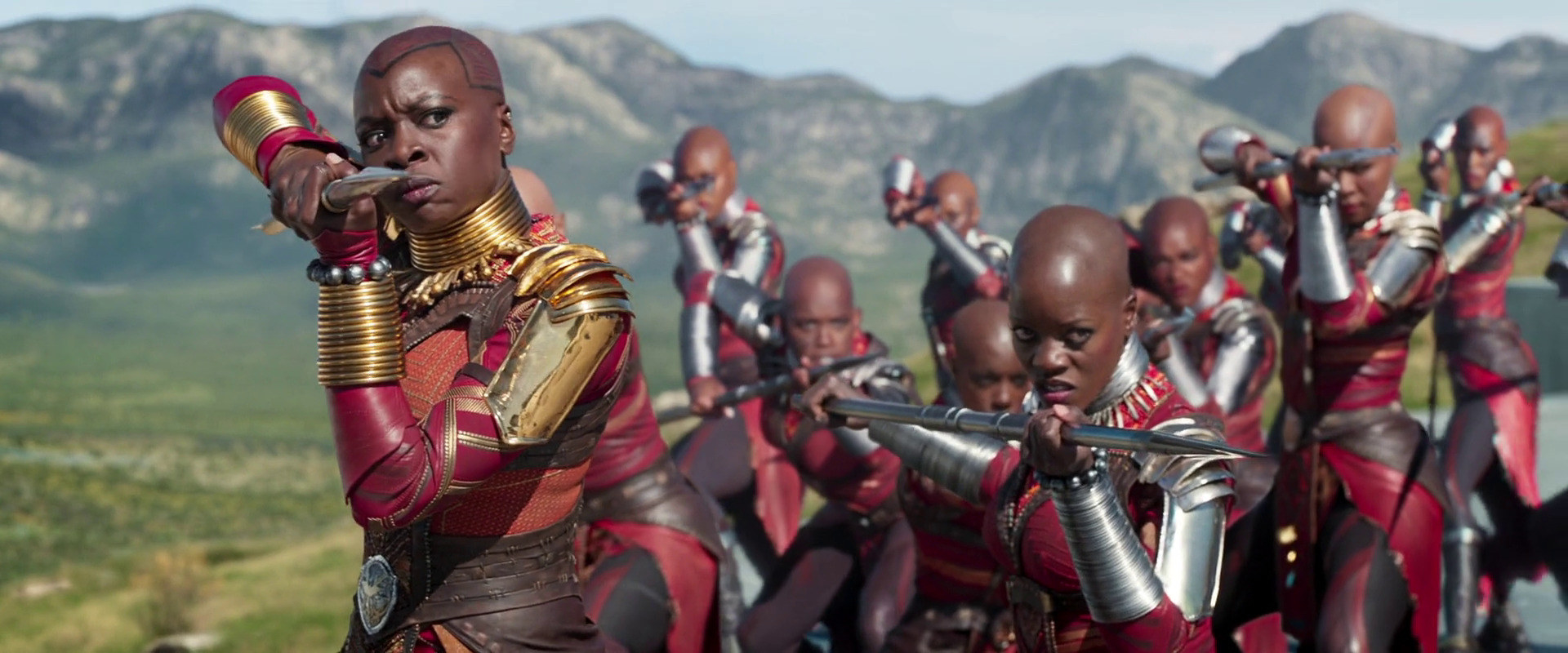 The Dora Milaje raise their spears