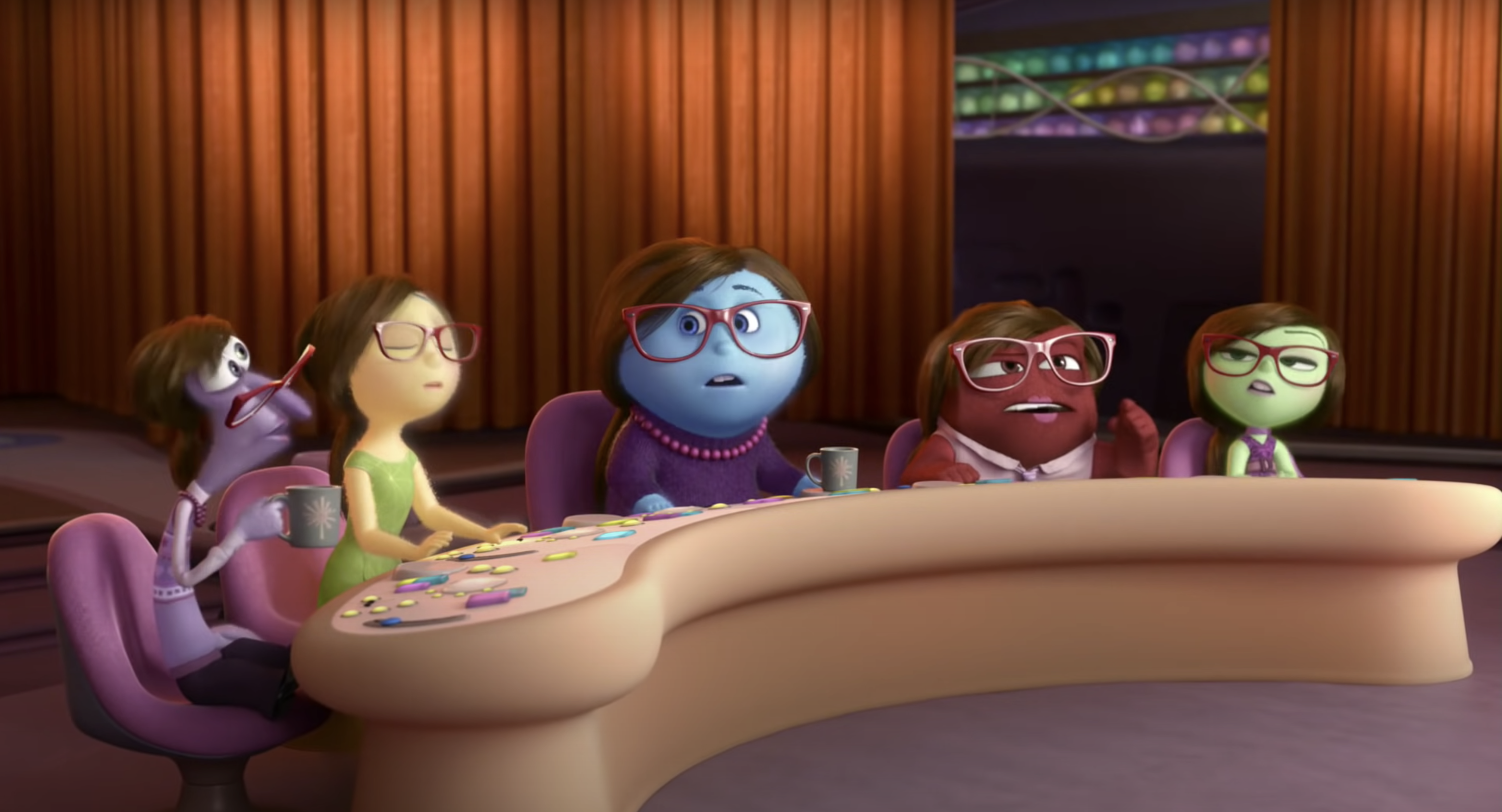 The emotions in Inside Out sitting at the table