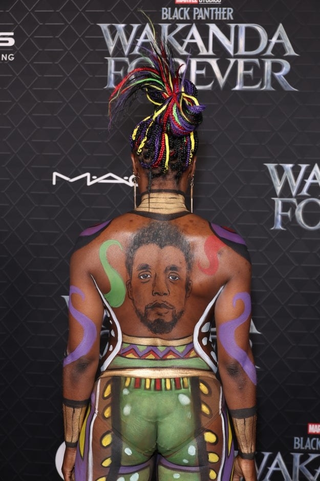 Janeshia Adams-Ginyard with a Chadwick Boseman memorial painted on her back