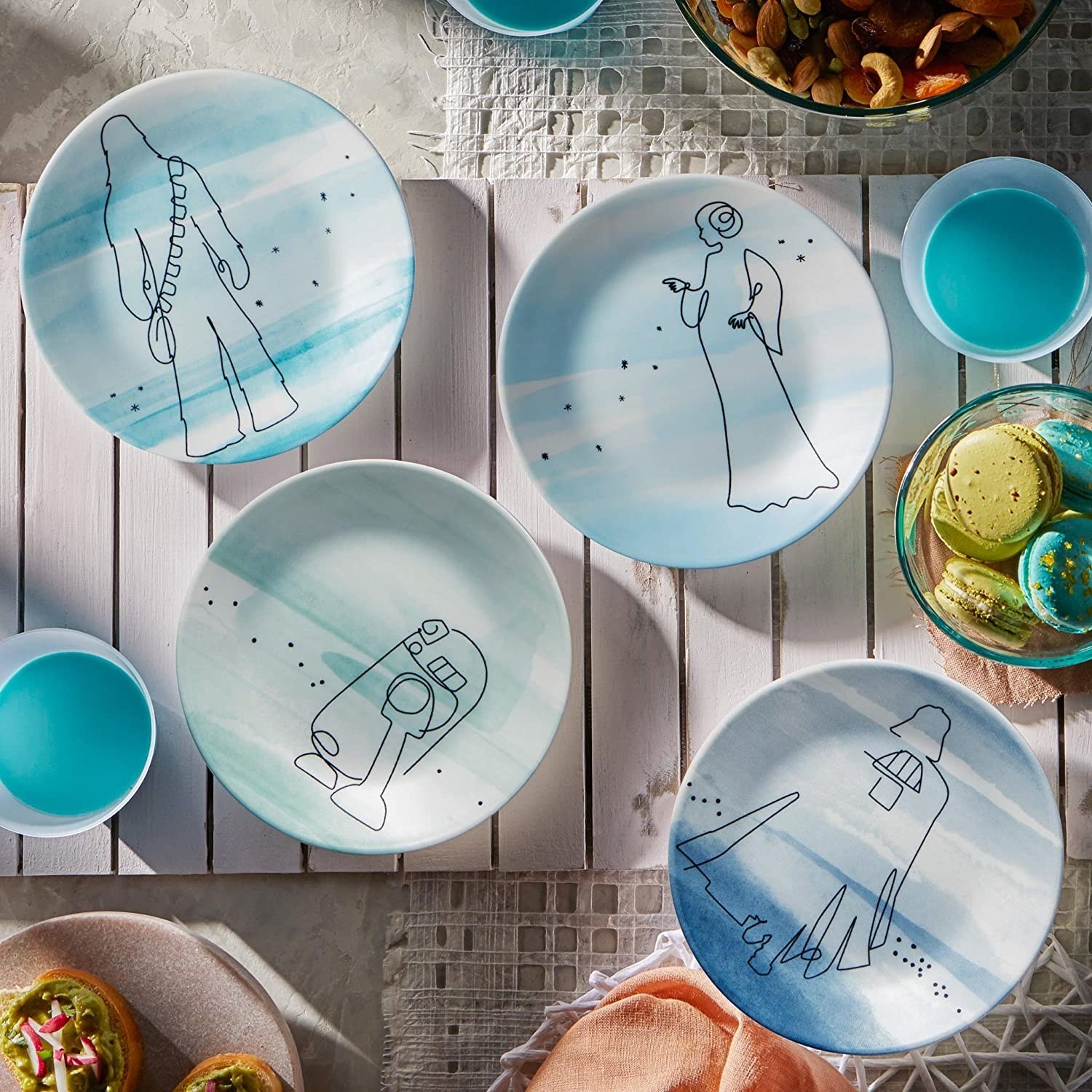 four blue star wars themed plates