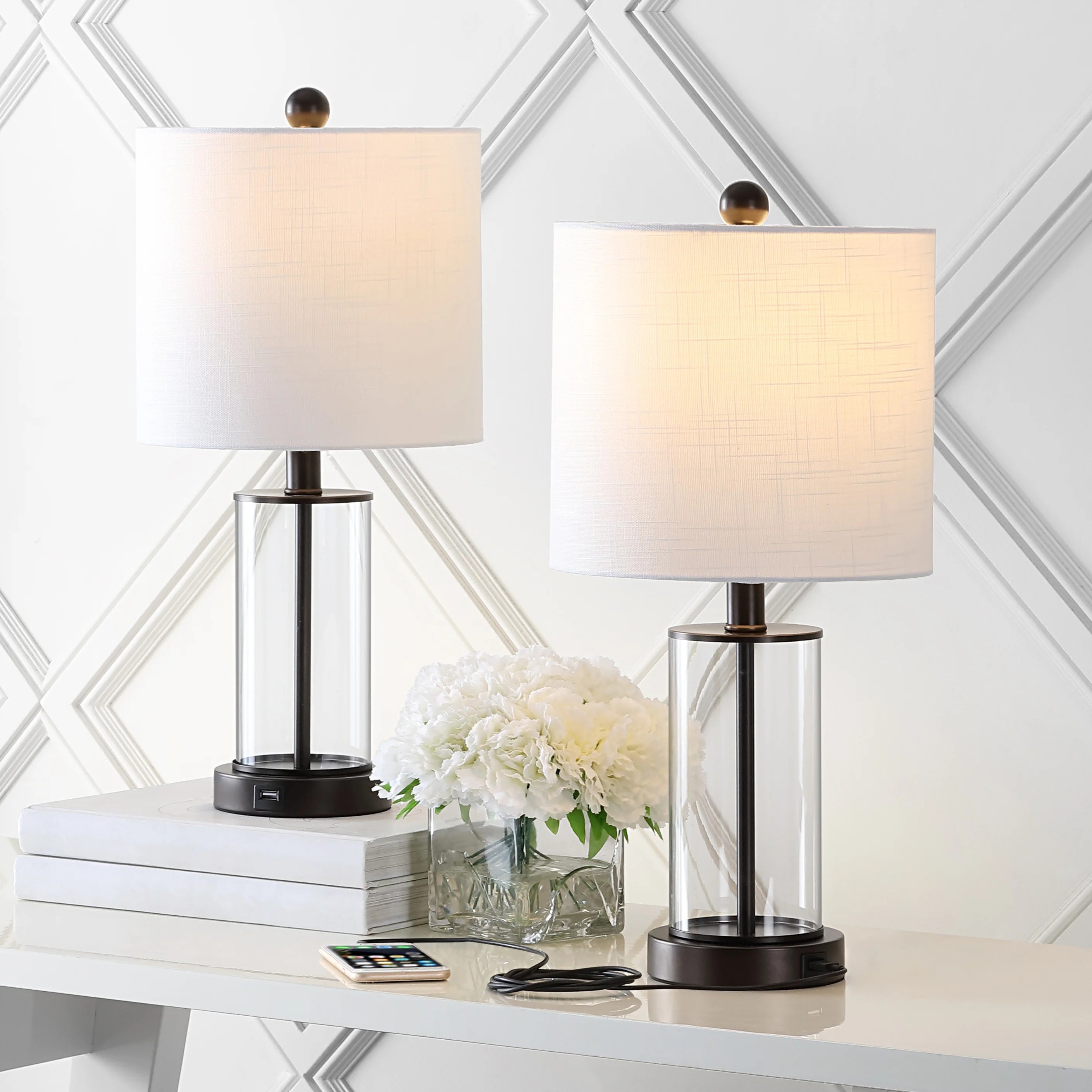 The lamps styled on a console table