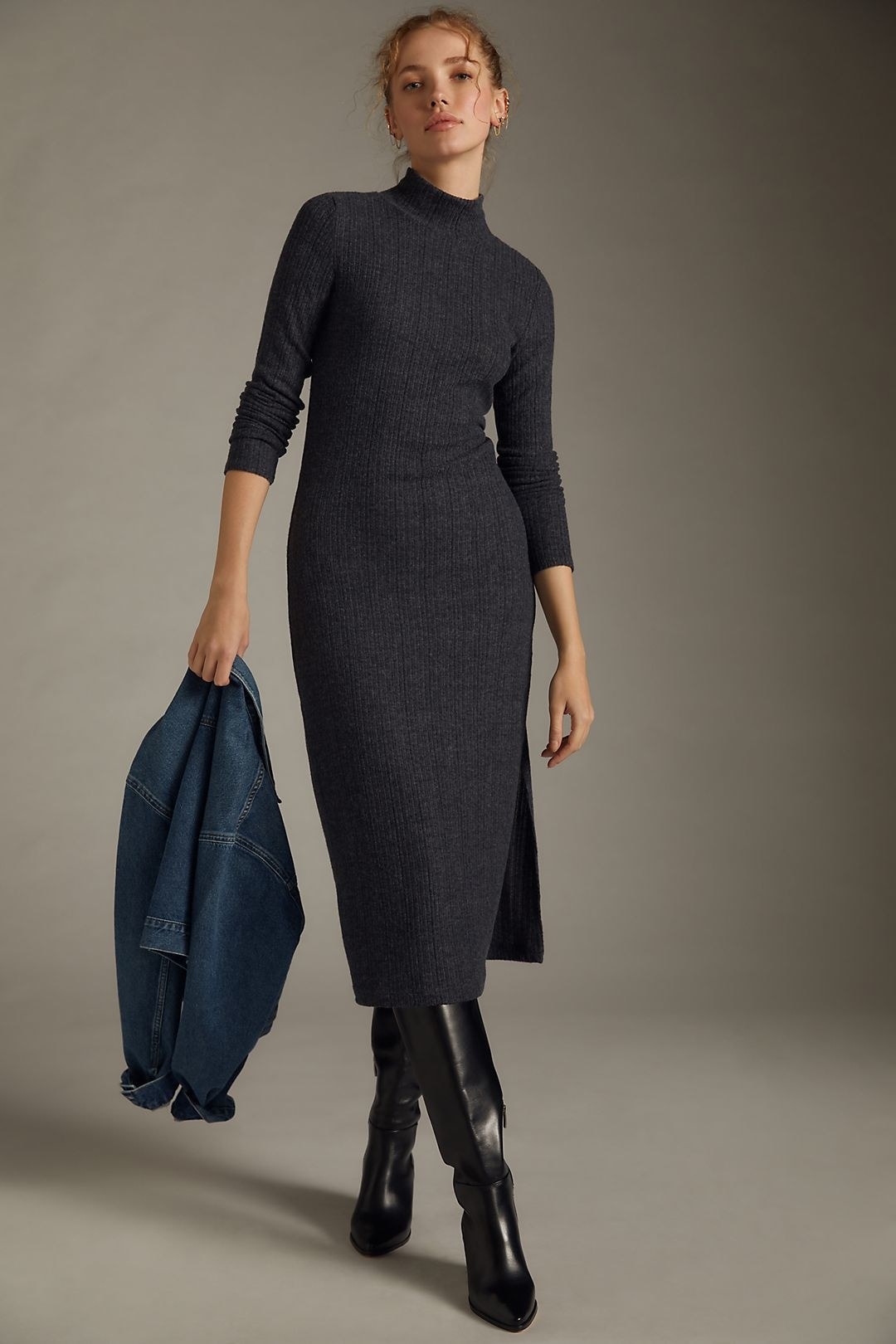 model in dark grey ribber turtleneck midi dress with long sleeves and side slits