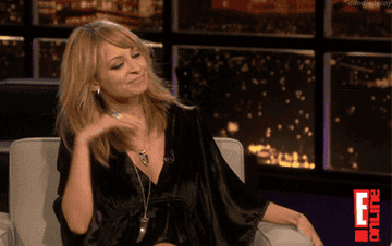 a gif of nicole richie flipping her hair