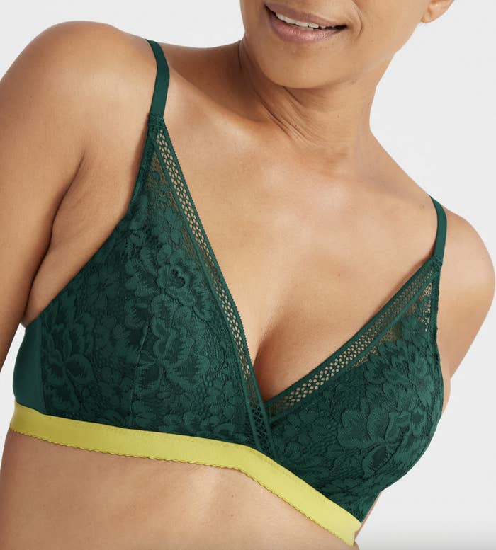 a close up of a person wearing the lacy plunge bralette