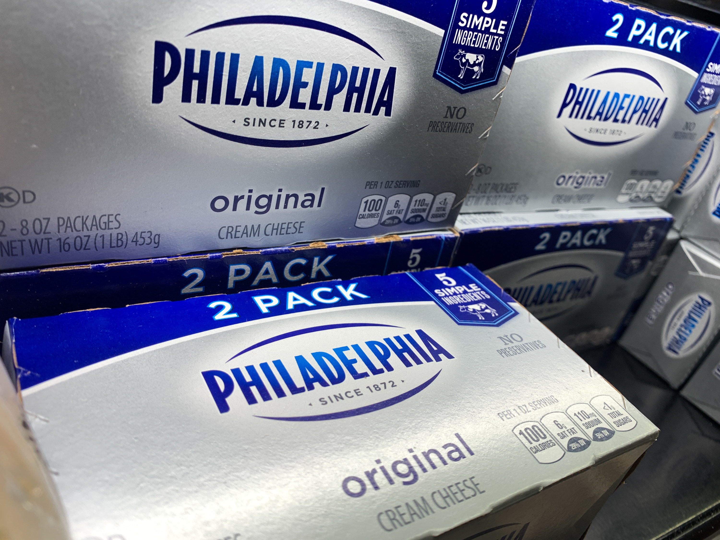 multiple philadelphia cream cheese packages on a shelf