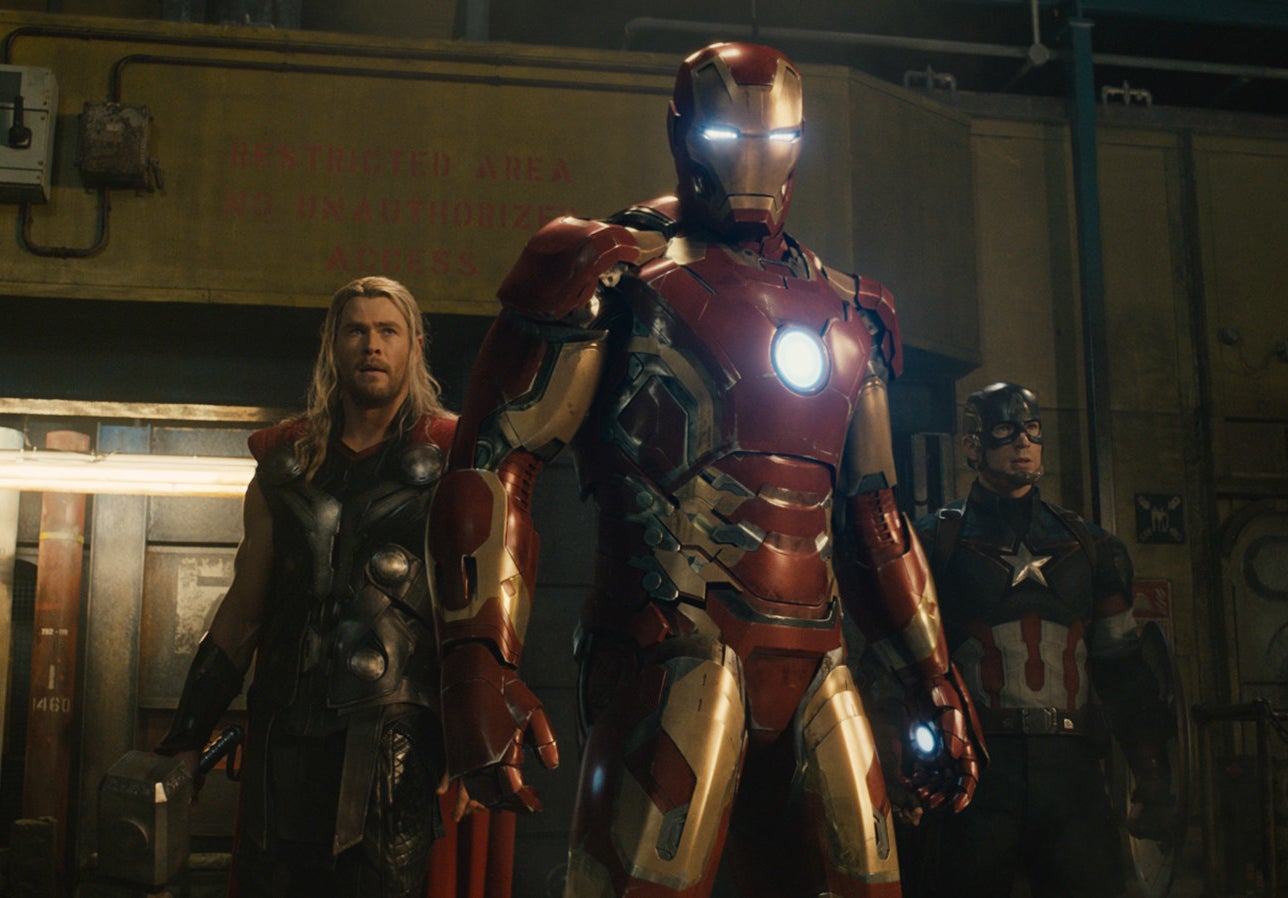 Iron Man stands in front of some of the other Avengers