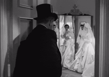Elizabeth Taylor as Kay Banks tries on her wedding dress in &quot;Father of the Bride&quot;