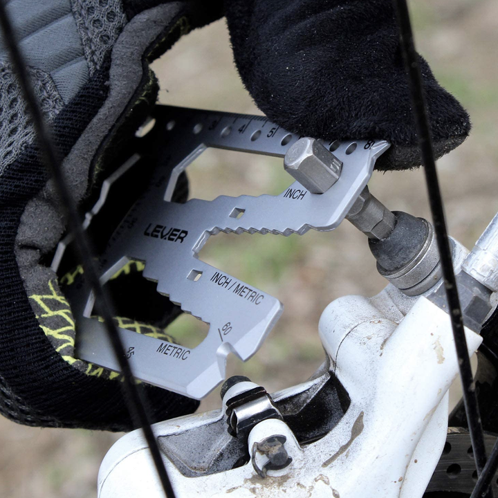 hand using the tool to tighten a screw