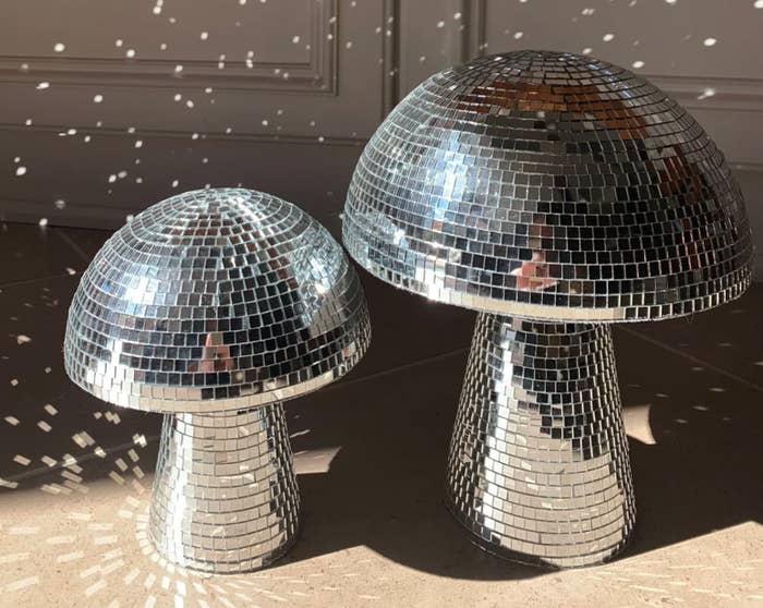 Two mirrored-discoball mushrooms on table